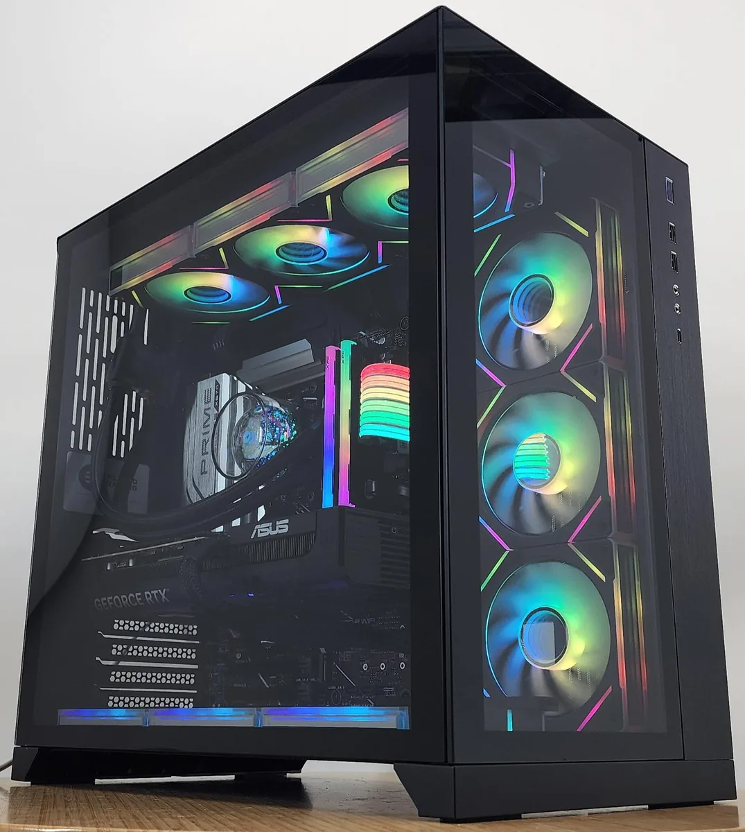 Black Lian Li O11 Dynamic ATX case with 360mm RGB AIO cooler visible through glass panels