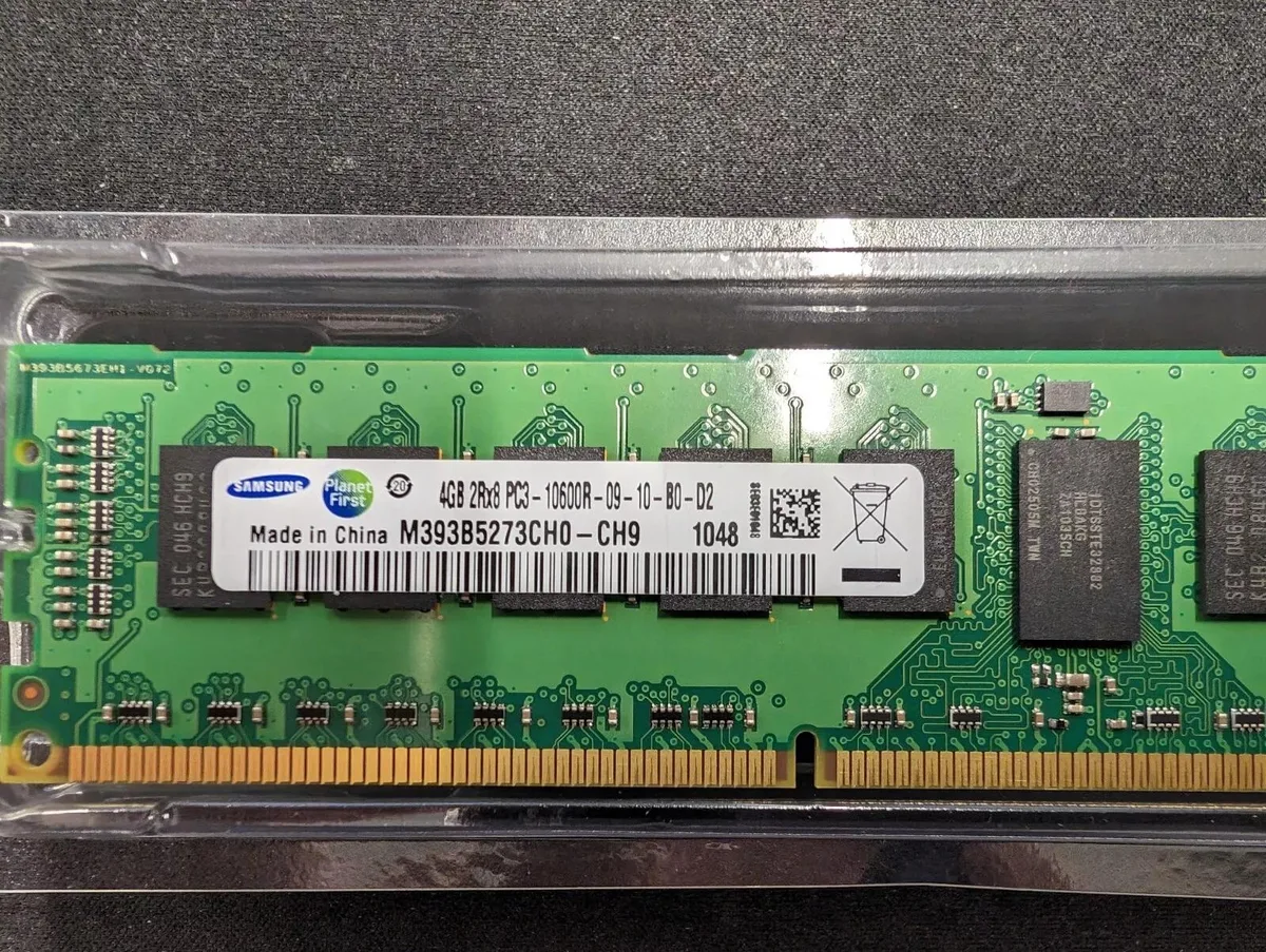 Green rectangular DDR3 memory module with gold edge connector and black chips