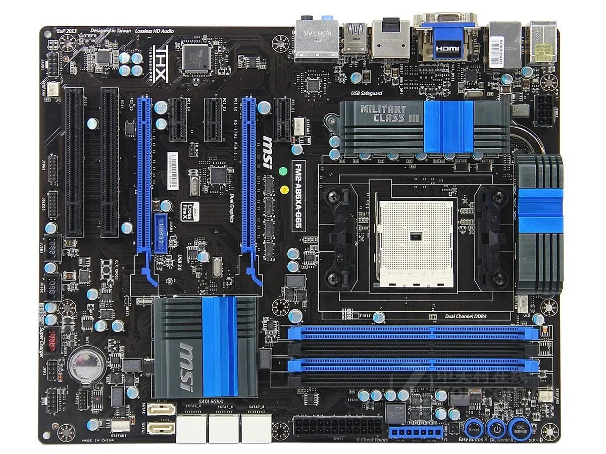 ATX motherboard with black PCB, silver heatsinks, Socket FM2, four DDR3 slots, multiple PCIe and PCI slots, rear I/O panel