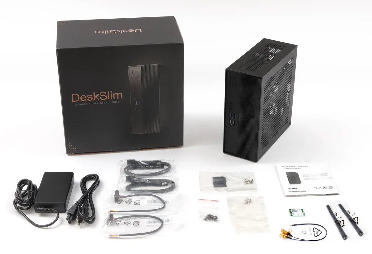 Black compact barebone mini PC chassis, front USB-C and Type-A ports visible