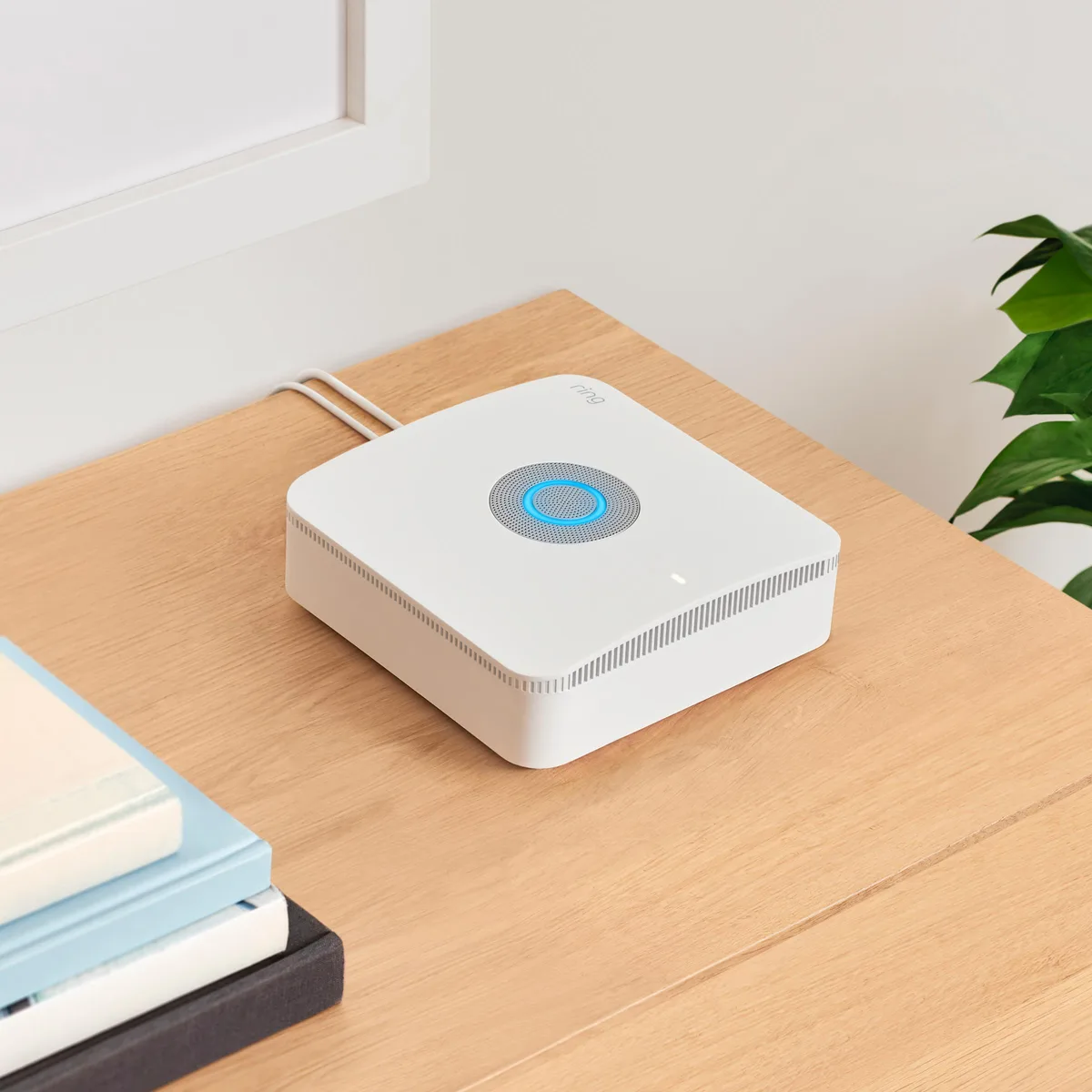 White rectangular base station with flat top and subtle branding
