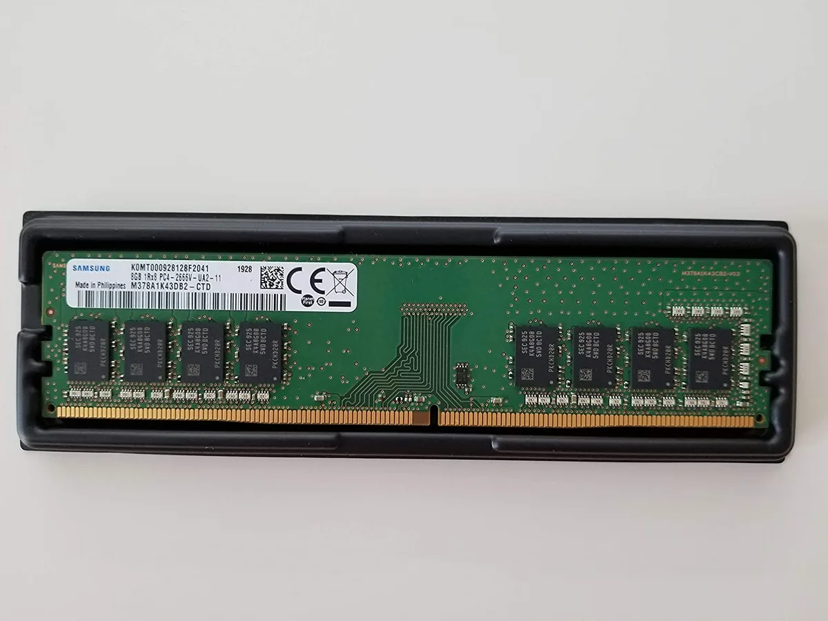 Green rectangular DDR4 memory module with gold edge connector and black chips
