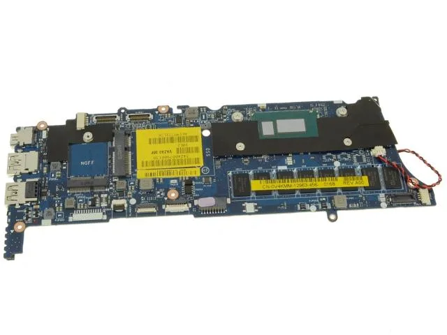 Green rectangular Dell XPS 9Q33 motherboard with silver CPU and black RAM slots