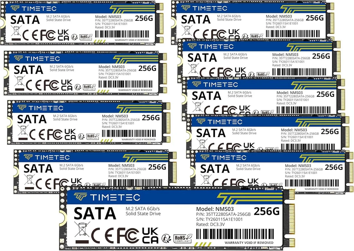 Ten M.2 2280 SATA SSDs in a pack, bare green circuit boards with black chips