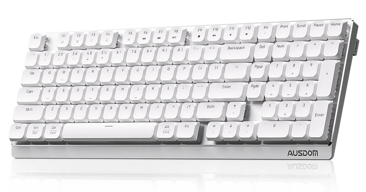 White low-profile wireless mechanical keyboard with number pad, compact rectangular shape, matte finish