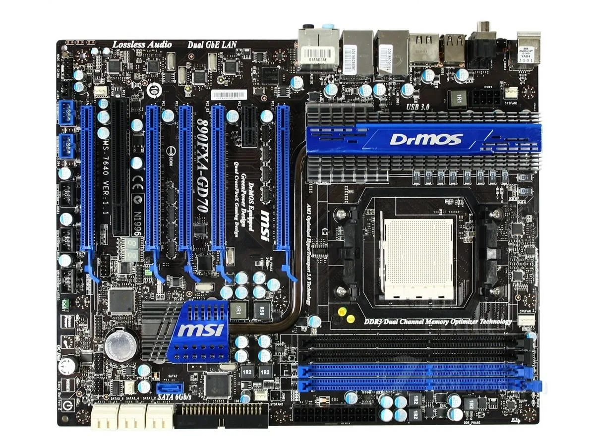 ATX motherboard, black PCB with blue slots and silver heatsinks