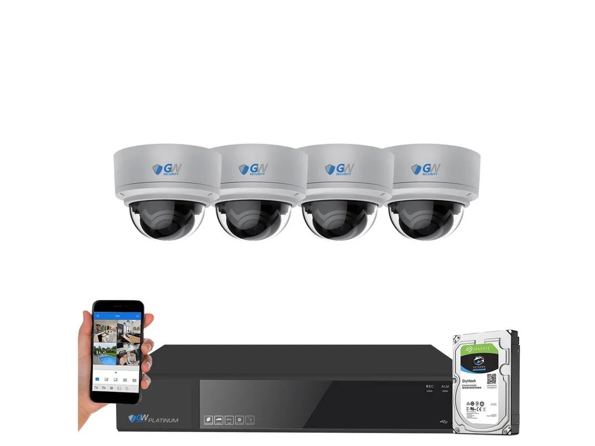White boxed NVR with four dome cameras and cables