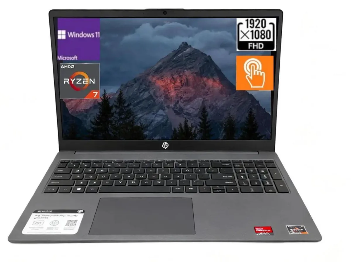 Silver-grey 15.6 inch touchscreen laptop, slim profile, full-size keyboard with numeric keypad