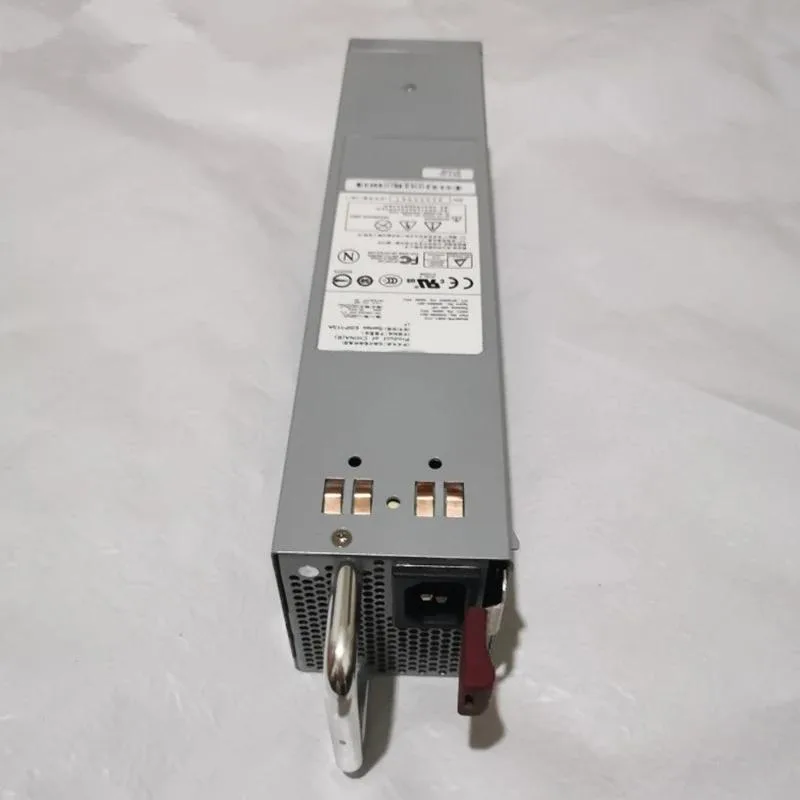 Rectangular silver ATX power supply unit with ventilation grille and label visible