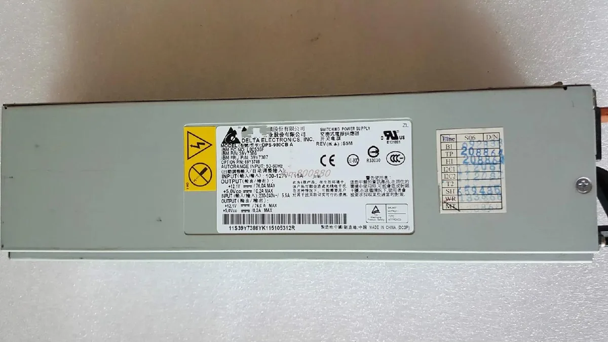 Rectangular ATX power supply unit with metal casing and cooling fan visible