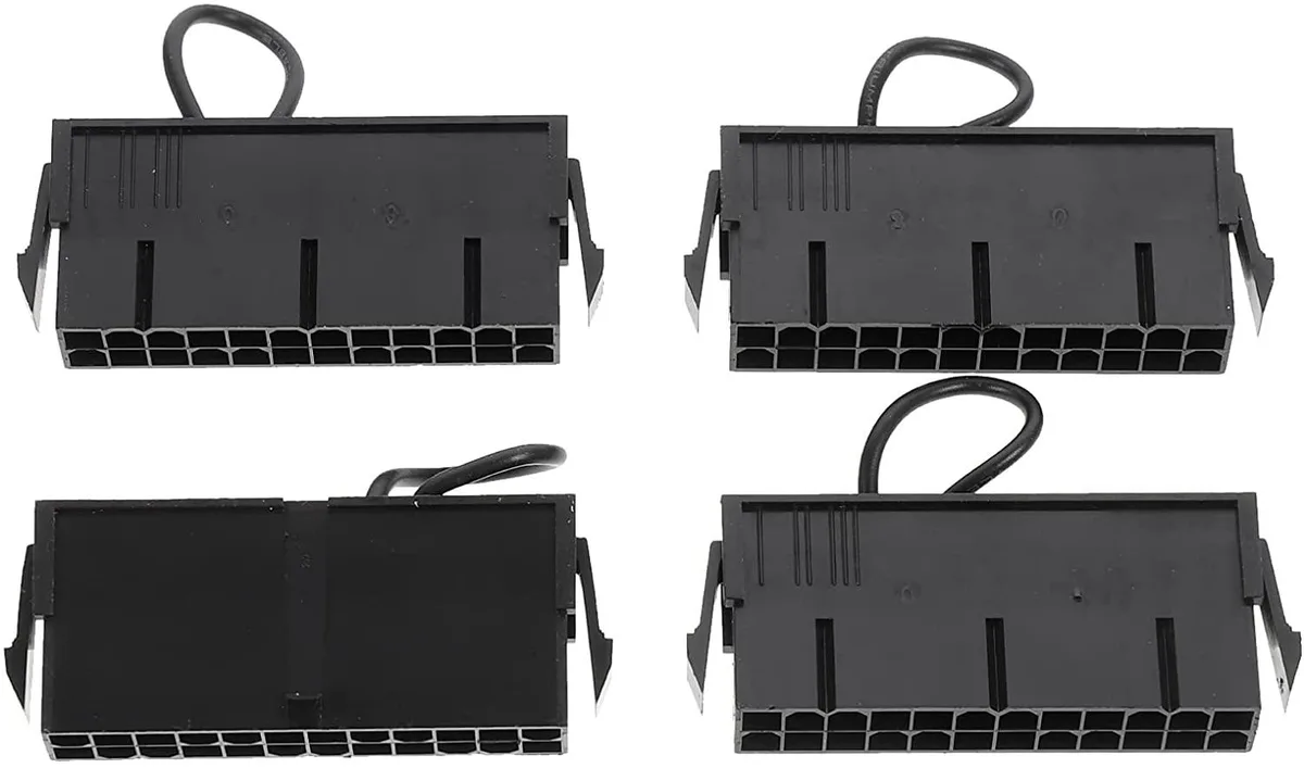 Four small black rectangular ABS ATX power supply testers