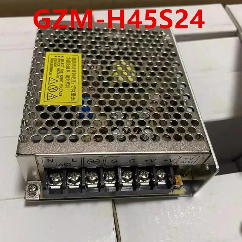 Small black ATX power supply unit with label showing 24V 45W