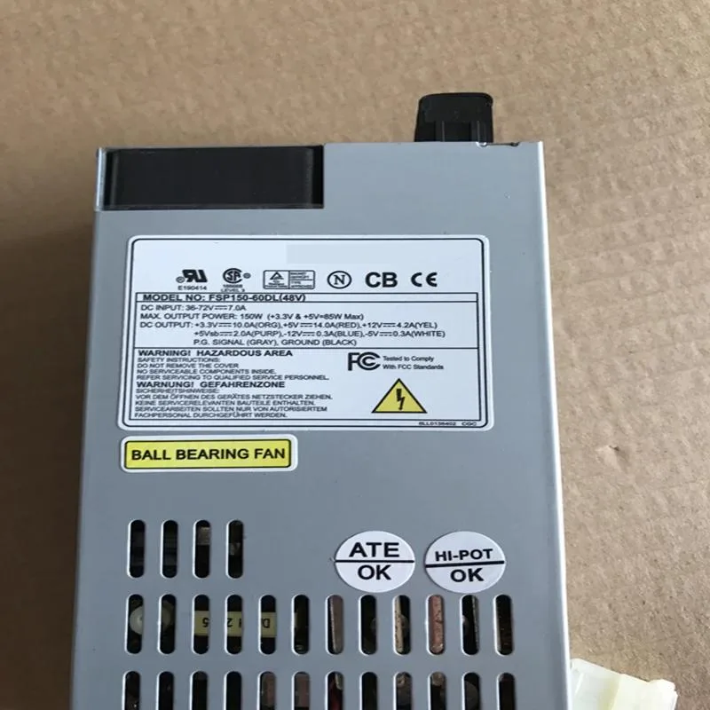 Compact 1U silver power supply unit with rear fan grille and DC input connector