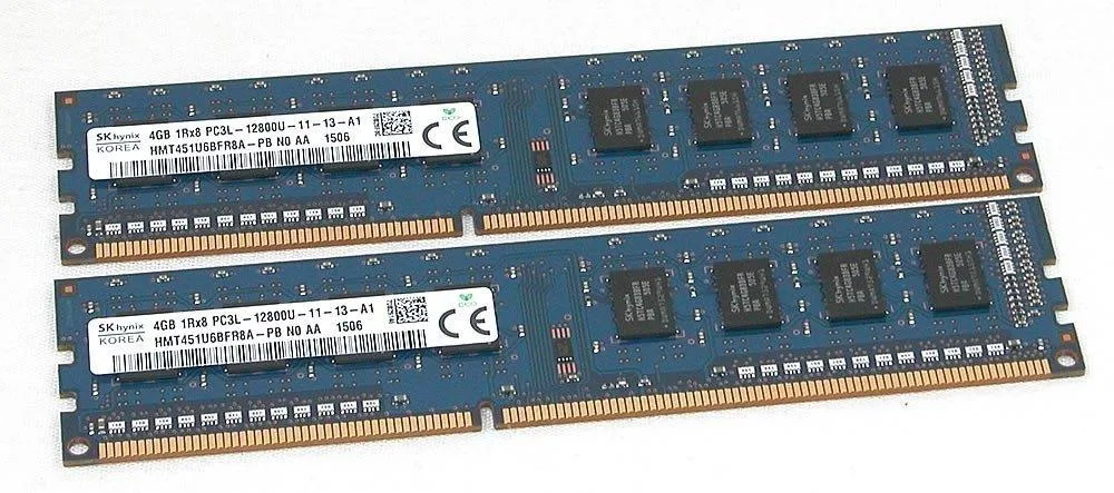 Two green DDR3 desktop memory modules with gold contacts