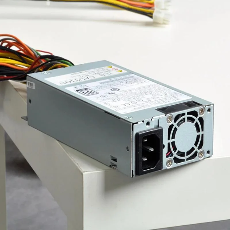 Compact 1U 400W power supply unit with metal casing and rear fan grille