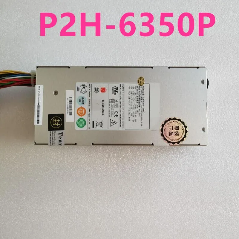 Rectangular silver ATX power supply unit with ventilation grille and cable bundle