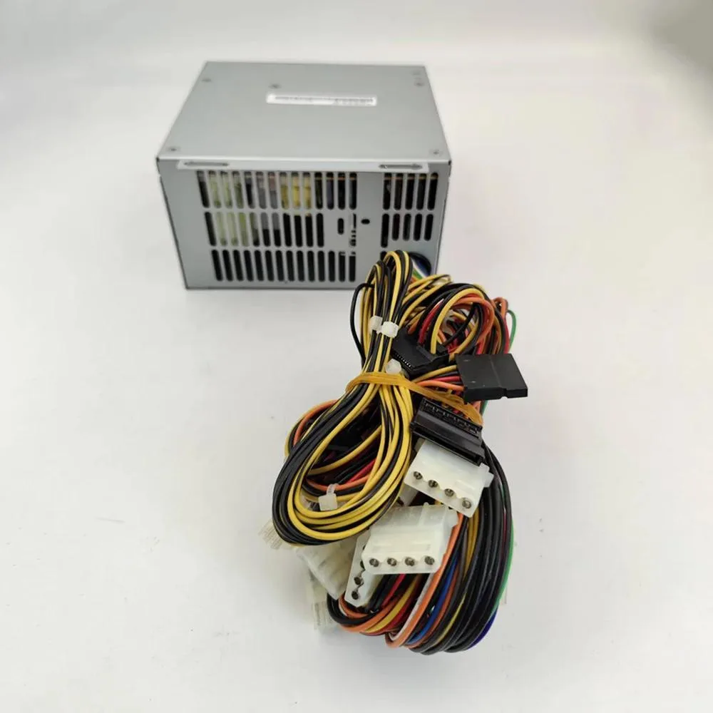Silver metal ATX power supply unit with cooling fan and cable connectors