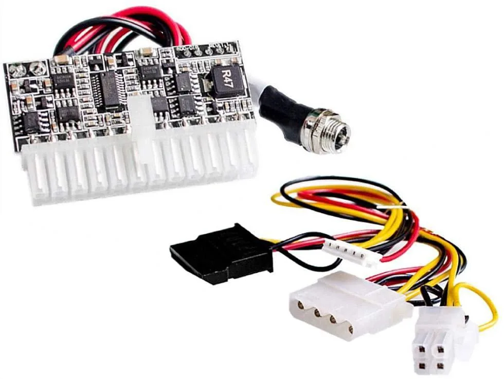 Small black rectangular DC-ATX power module with 24-pin ATX connector and attached cable kit