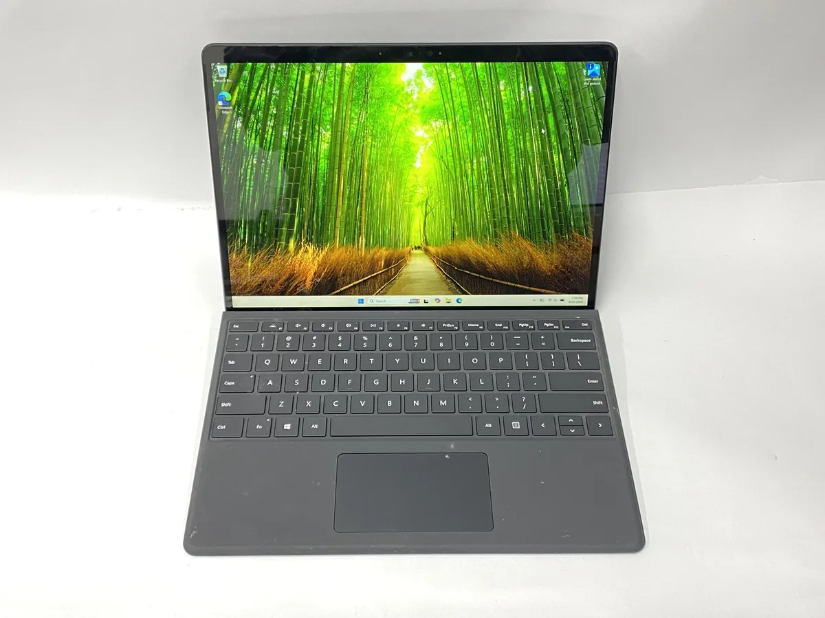 Thin silver tablet with 13 inch touchscreen and detachable keyboard attached