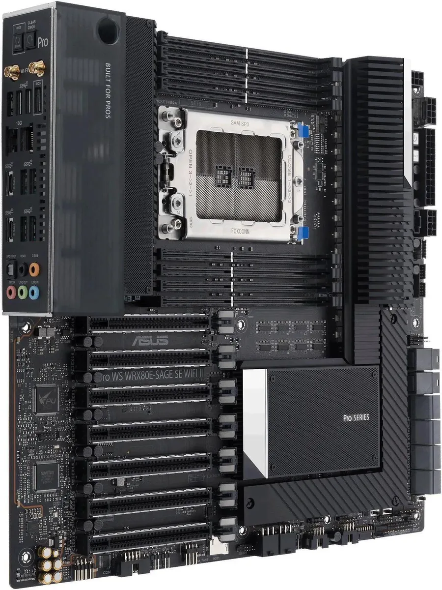 Rectangular E-ATX motherboard with dark PCB, silver heatsinks and rear I/O panel
