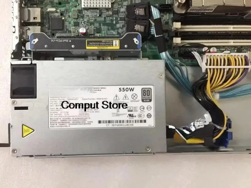 Rectangular metal power supply unit with ventilation grille and label showing part numbers