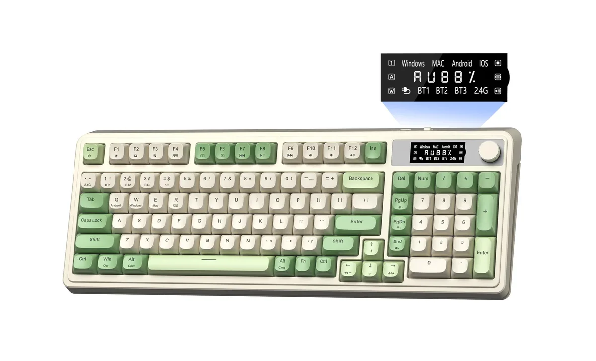 Green 99-key membrane keyboard with display screen and rotary knob, black keycaps, coiled cable visible