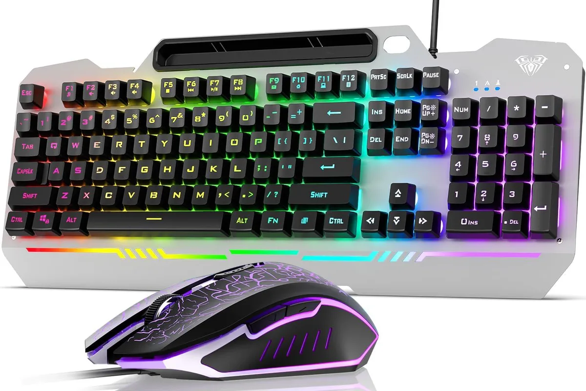 Black full-size keyboard with brushed metal panel and matching mouse, both RGB backlit, wired, with phone holder bracket