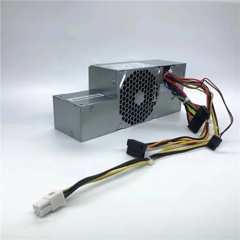 Rectangular metal ATX power supply unit with fan grille and cable bundle