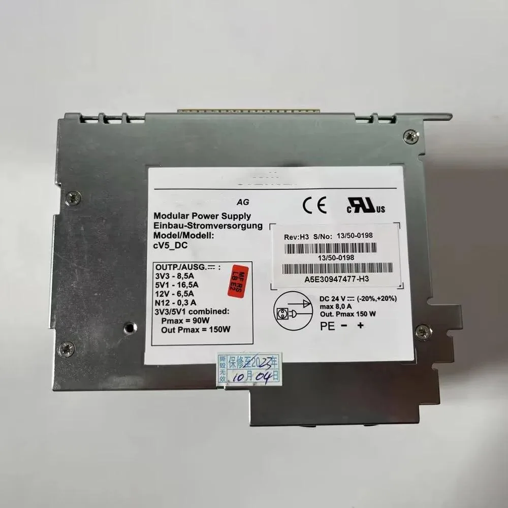 Rectangular silver ATX power supply unit with ventilation grille and power socket visible
