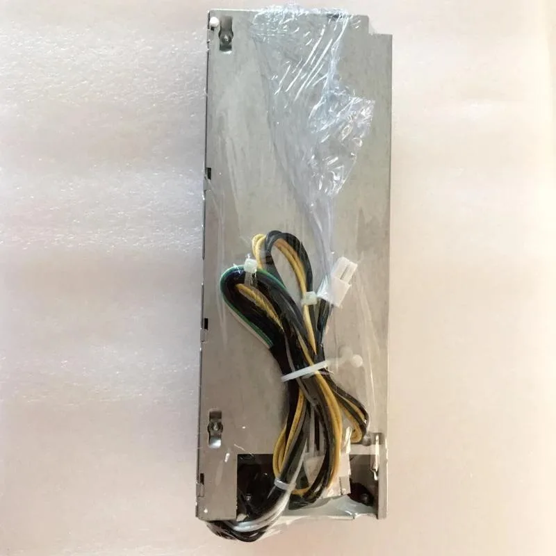 Silver rectangular ATX power supply unit with fan grille and cable connectors