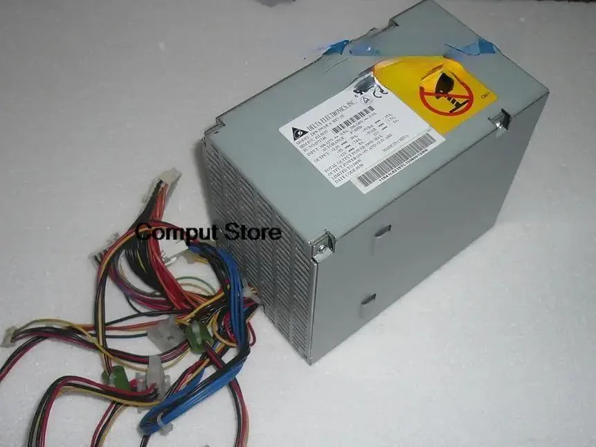 Rectangular metal ATX power supply unit with ventilation grille and label showing model numbers