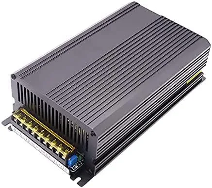 Silver rectangular AT power supply unit with ventilation slots and terminal connections
