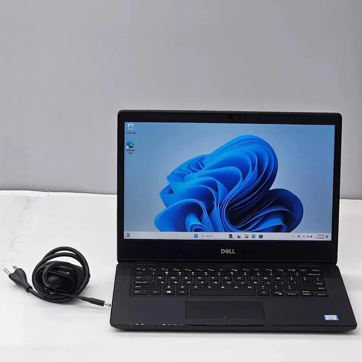 Silver Dell Latitude 3400 laptop closed 14 inch screen