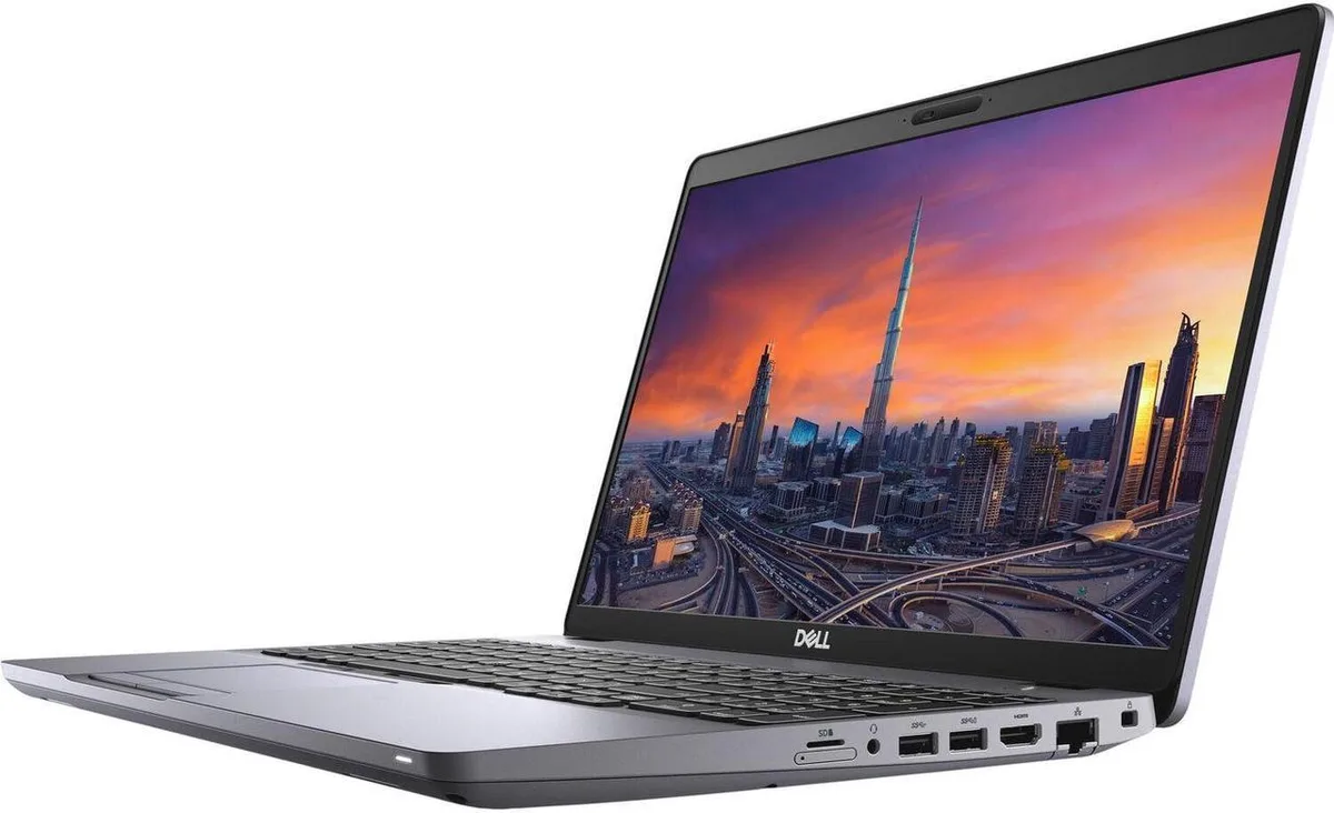 Silver Dell Precision 3551 laptop with 15.6 inch screen, visible cosmetic wear on case