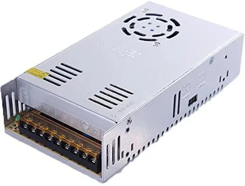 Silver aluminium rectangular unit with screw terminals and voltage selector switch