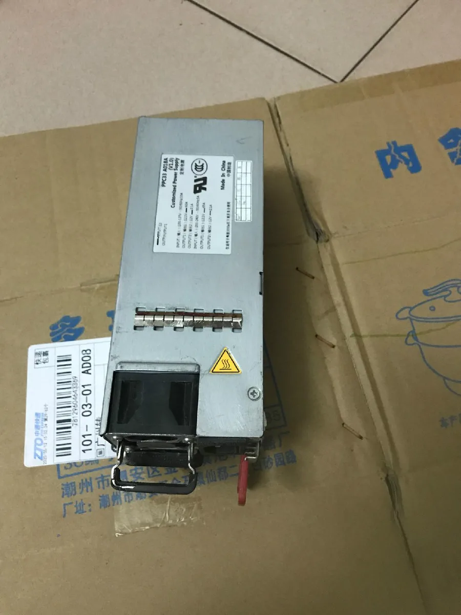 Rectangular silver ATX power supply unit with ventilation grilles and rear connector panel