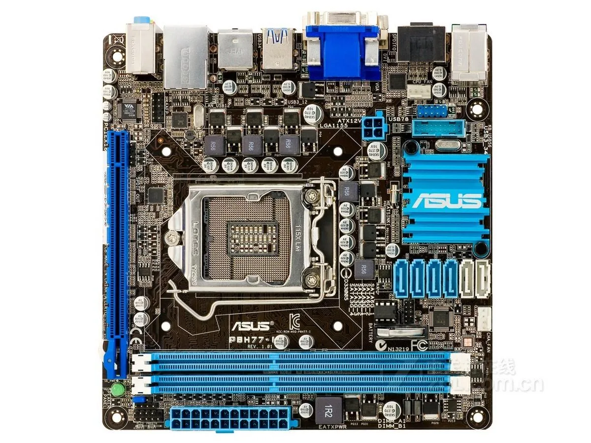 Green Mini-ITX motherboard with silver CPU socket and black DDR3 slots