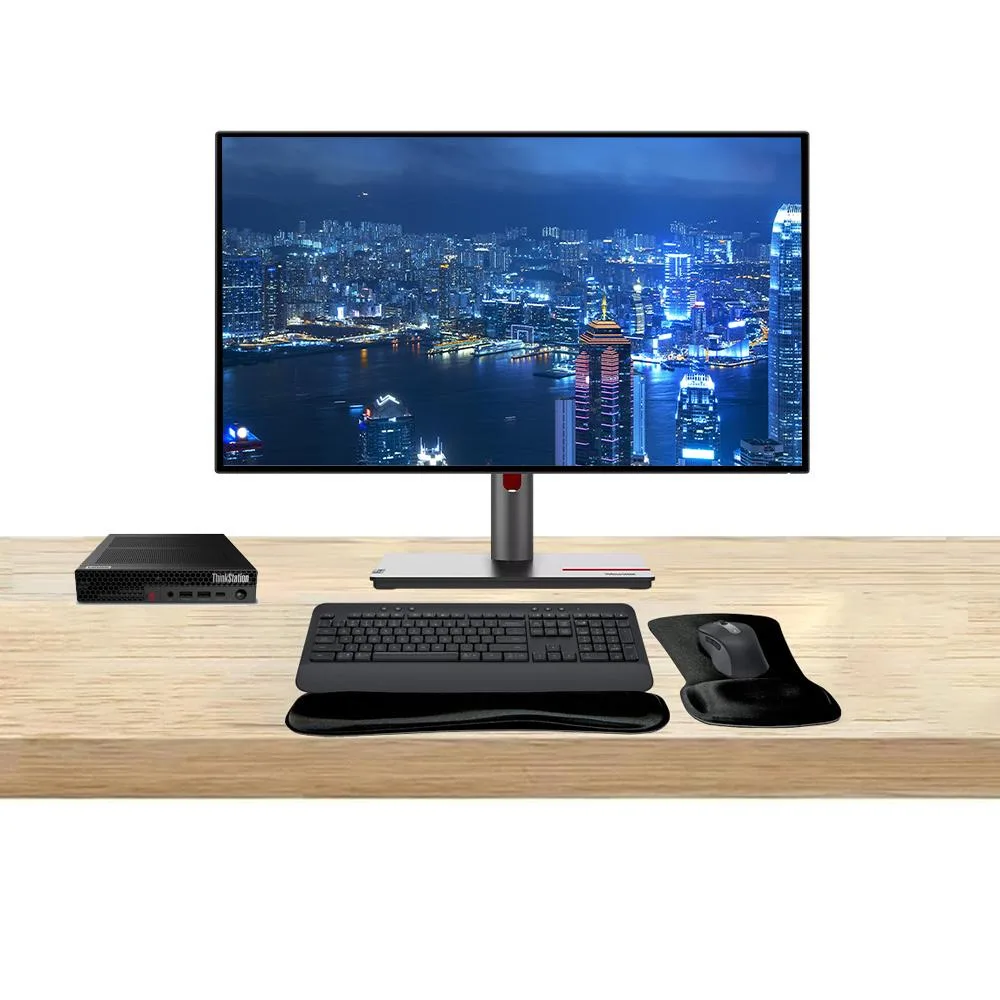 Compact silver mini PC, two 27 inch QHD monitors with thin bezels, graphite wireless keyboard and mouse with wrist rest