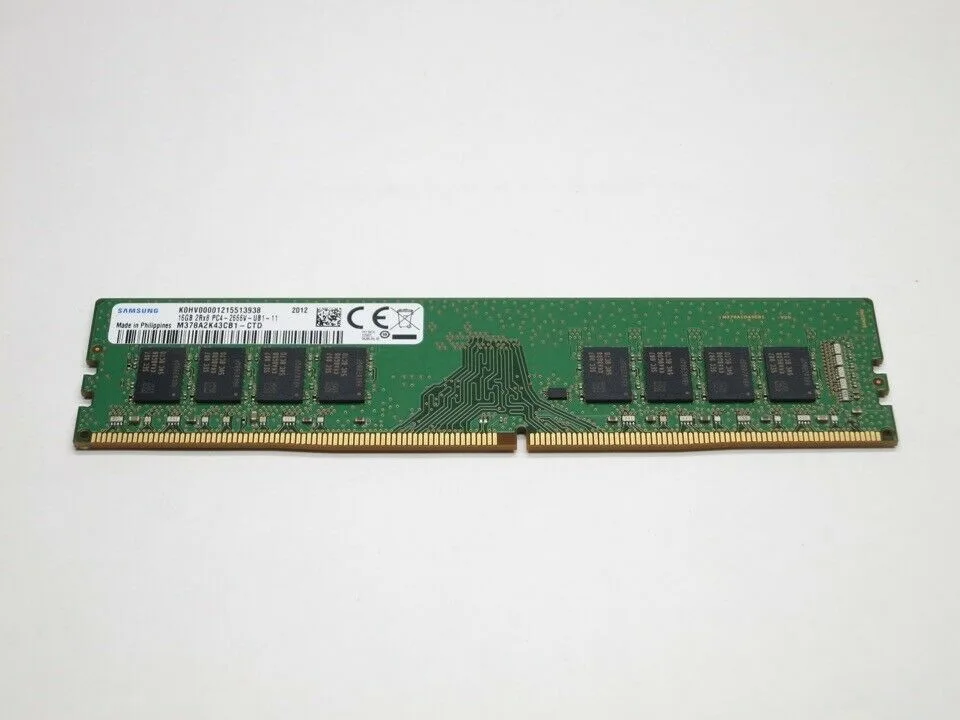 Green rectangular circuit board with black memory chips and gold edge connectors