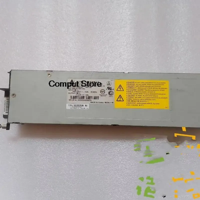 Rectangular ATX power supply module, matte metal casing, label with part numbers