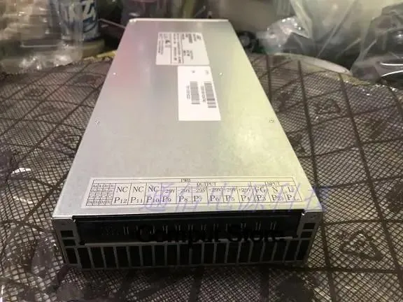 KHACHIMO NE100AC24ATEZ ATX power supply unit, rectangular metal casing with ventilation grille and connector sockets