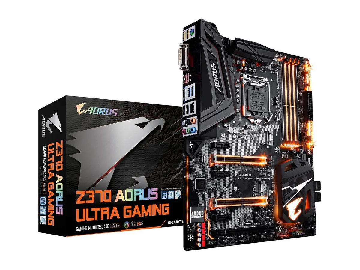 Black ATX motherboard with silver heatsinks and RGB lighting zones