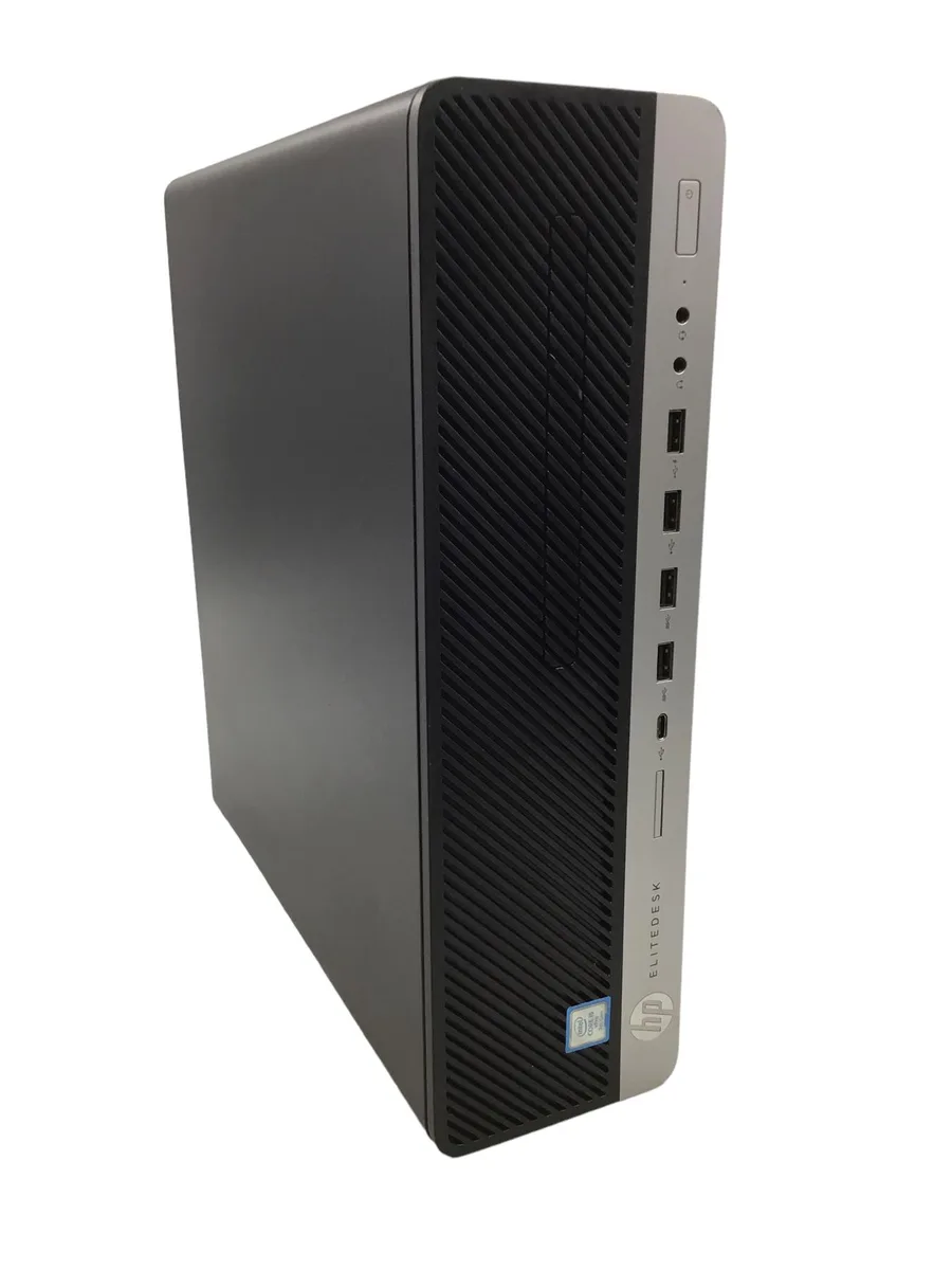Compact black SFF desktop tower with wired keyboard mouse and USB WiFi adapter