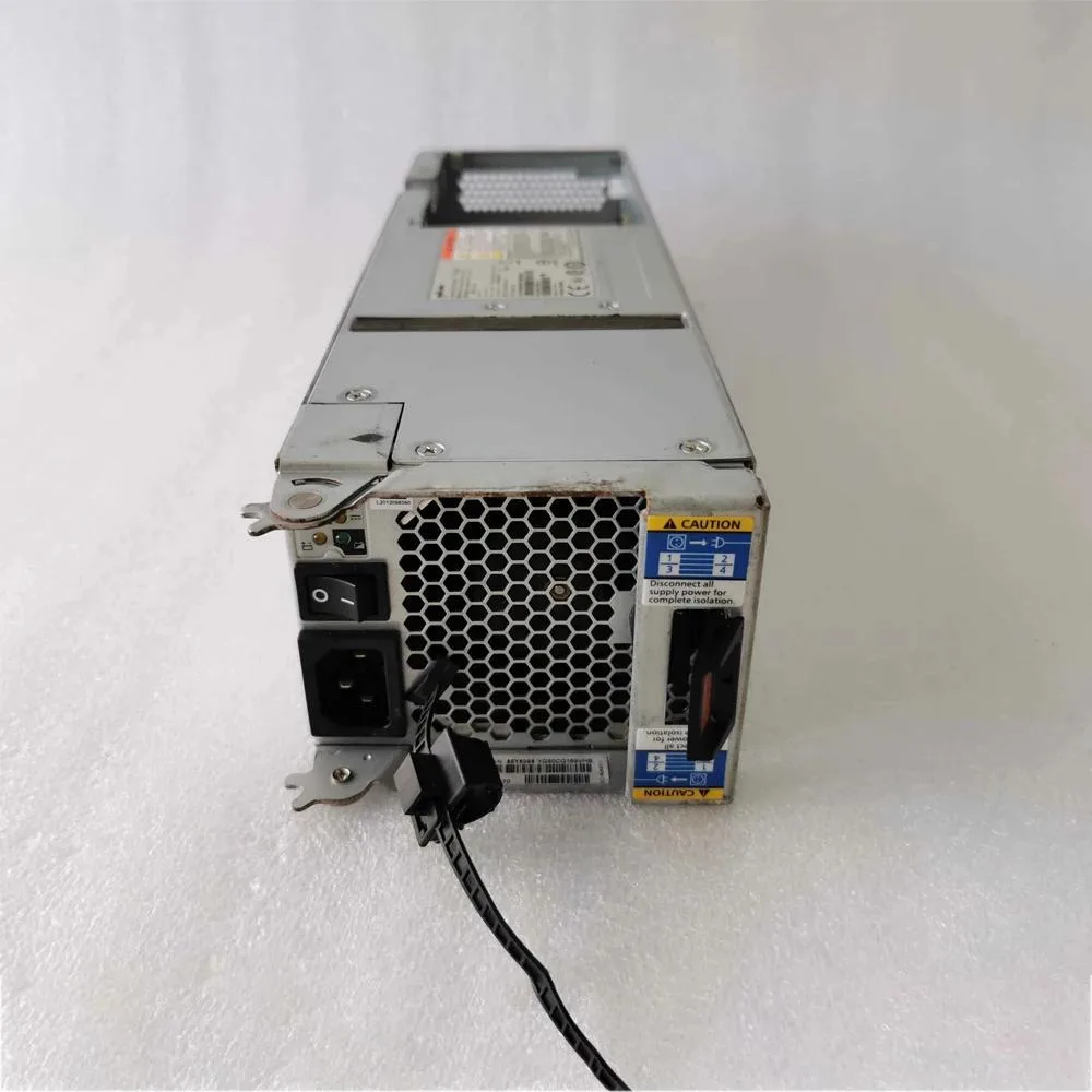 Rectangular silver metal power supply unit with ventilation grille and rear connector panel