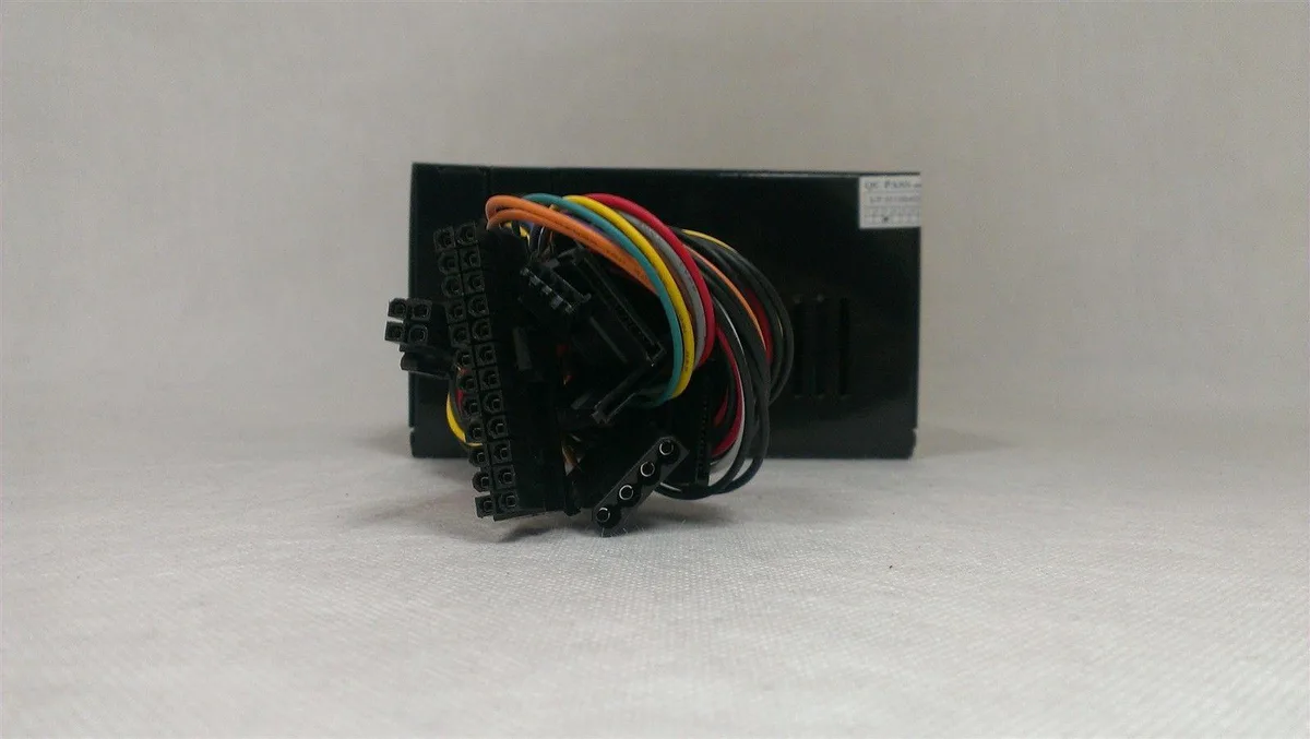 Grey ATX power supply unit with single fan and multiple connectors