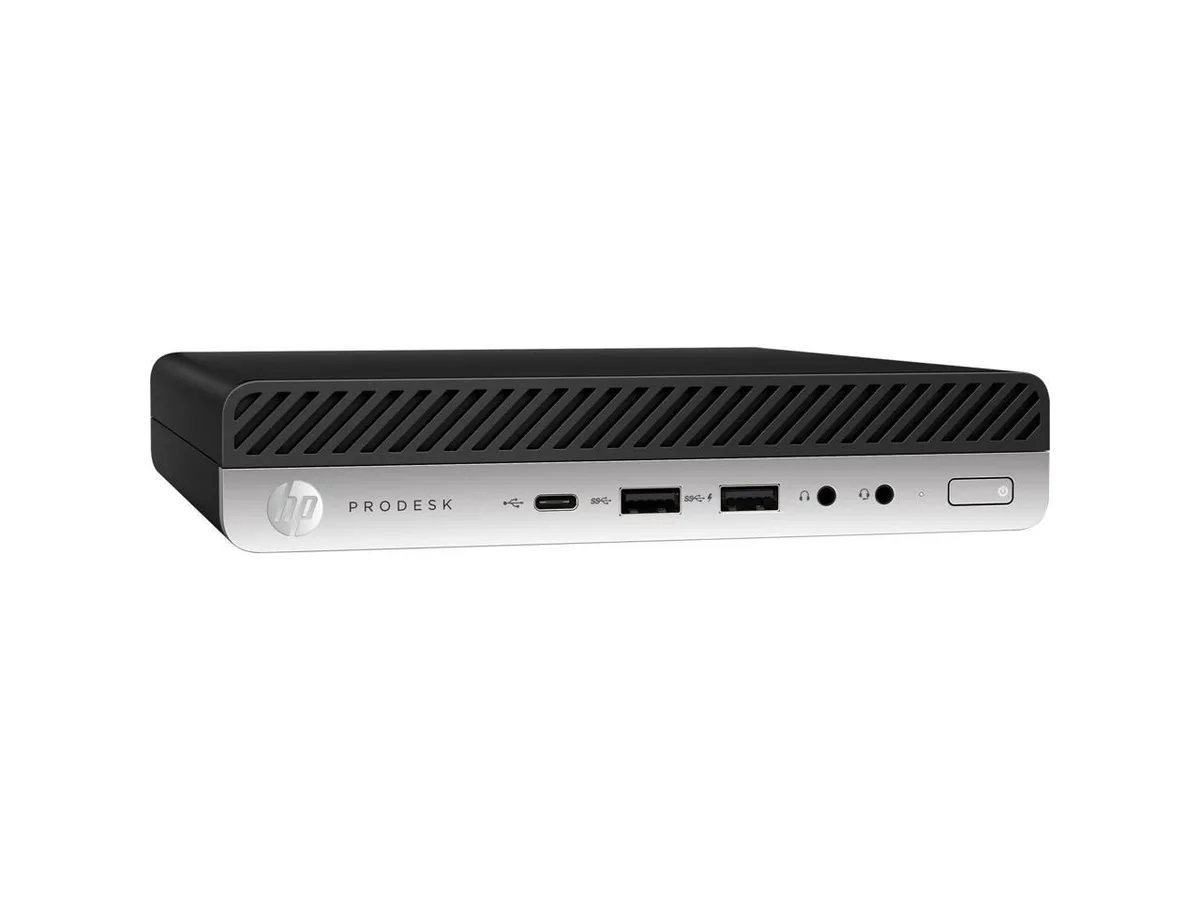 Small black mini desktop PC with compact square chassis and front USB ports