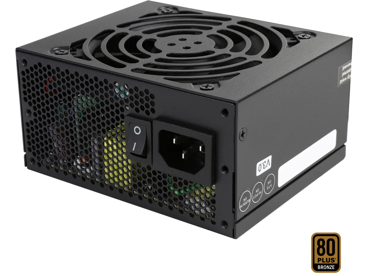Compact silver SFX power supply with 92mm fan and modular cables visible