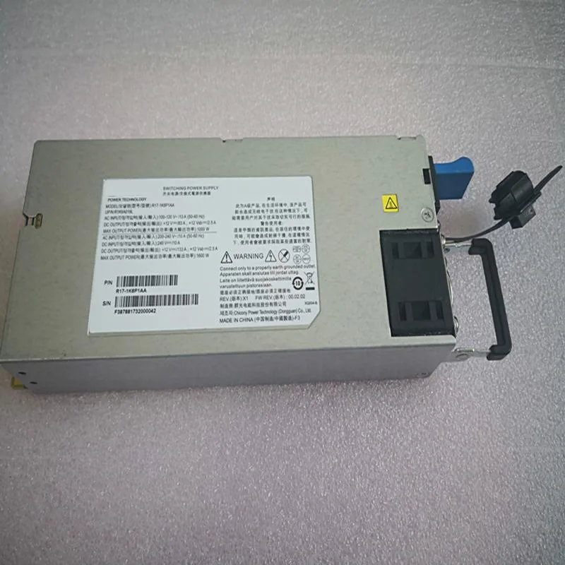 Rectangular silver power supply unit with rear fan grille and side label