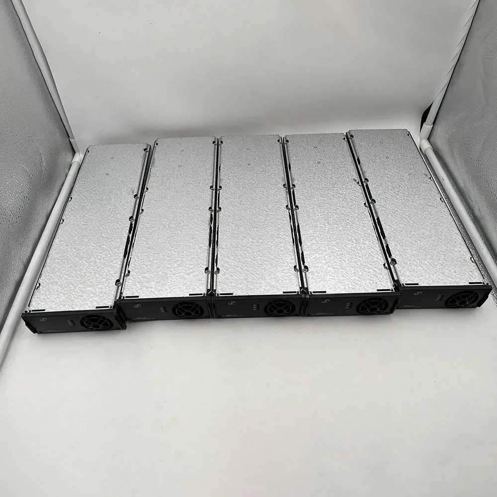 Rectangular silver metal power supply module with front handle and ventilation slots