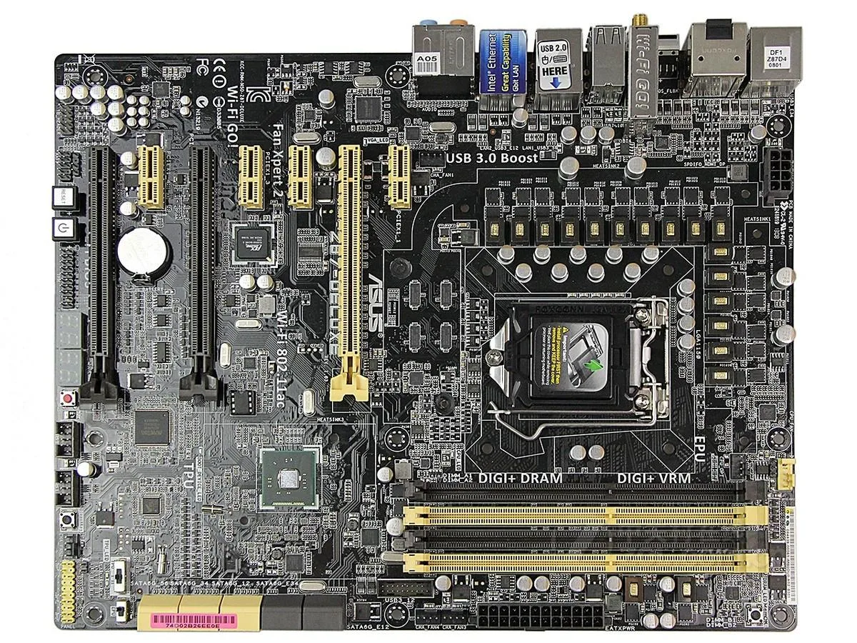 Black ATX motherboard with silver heatsinks and DDR3 slots